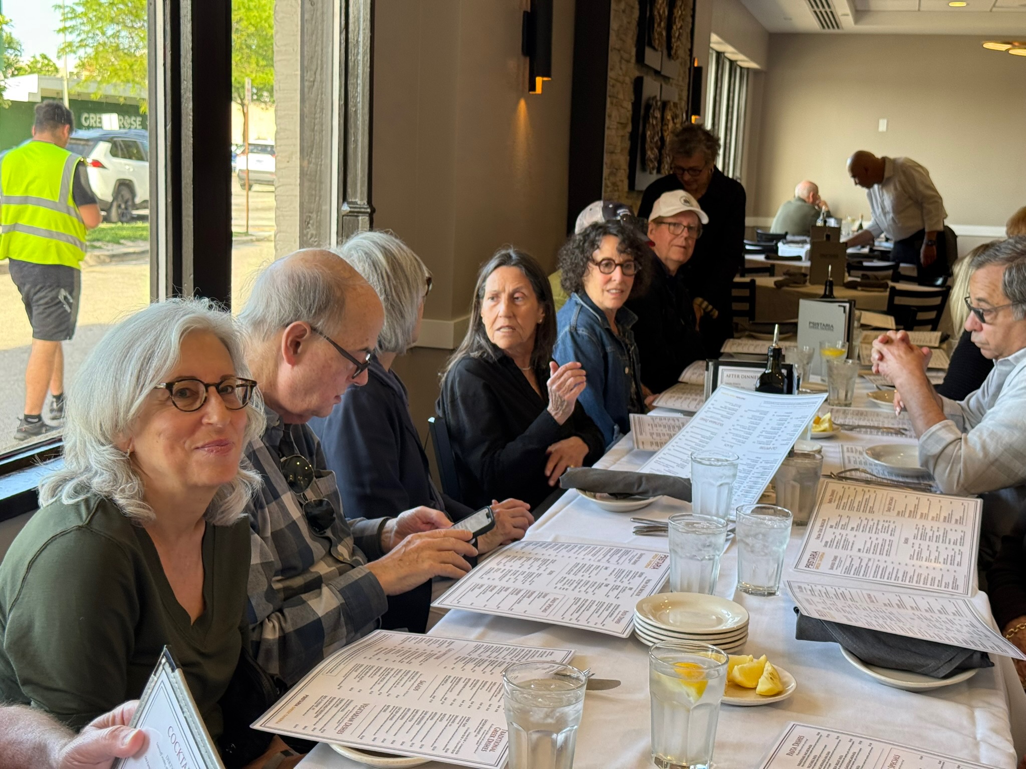 Members of the Glencoe coffee group gathered at a long table
